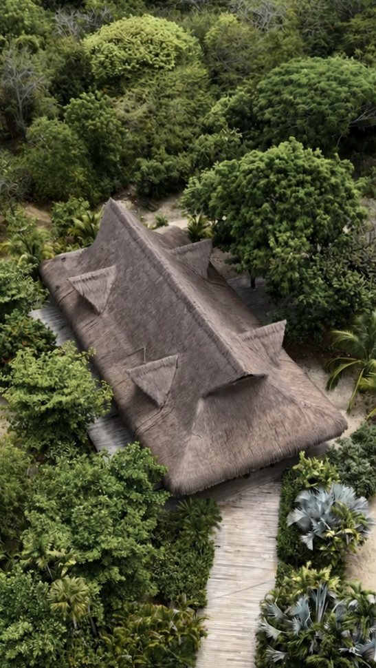 Thatched hotel architecture surrounded by tropical forest